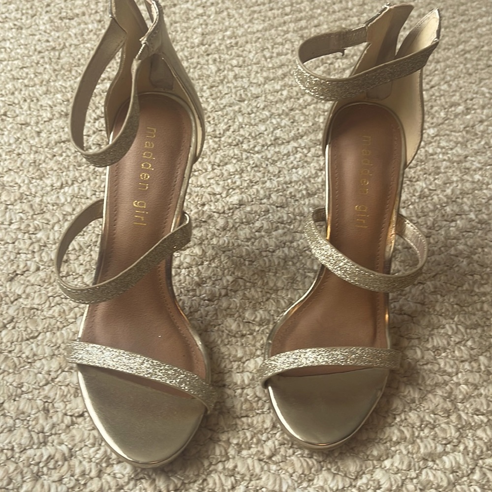 4 inch gold strappy madden girl heels. Straps have elastic to fit wider feet.EUC